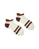 Pair of white socks with brown accents on a white background